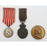 A commemorative medal, Saint Helena, campaigns 1792 to 1815, an Italian campaign medal 1859 and a