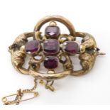 A Victorian yellow metal garnet set brooch, weight 10.6gms Condition Report:Available upon request