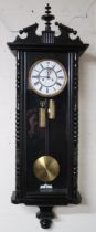 A 20th century ebonised Vienna style wall clock, a walnut writing slope and assorted walking