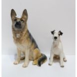 A Beswick model of a sitting Alsatian, impressed 2410 to base, and a porcelain model of a Schnauzer,