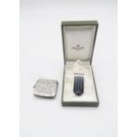 A Christofle Paris silver Art Deco money clip, with box, and a silver vesta, with engraved scrolling