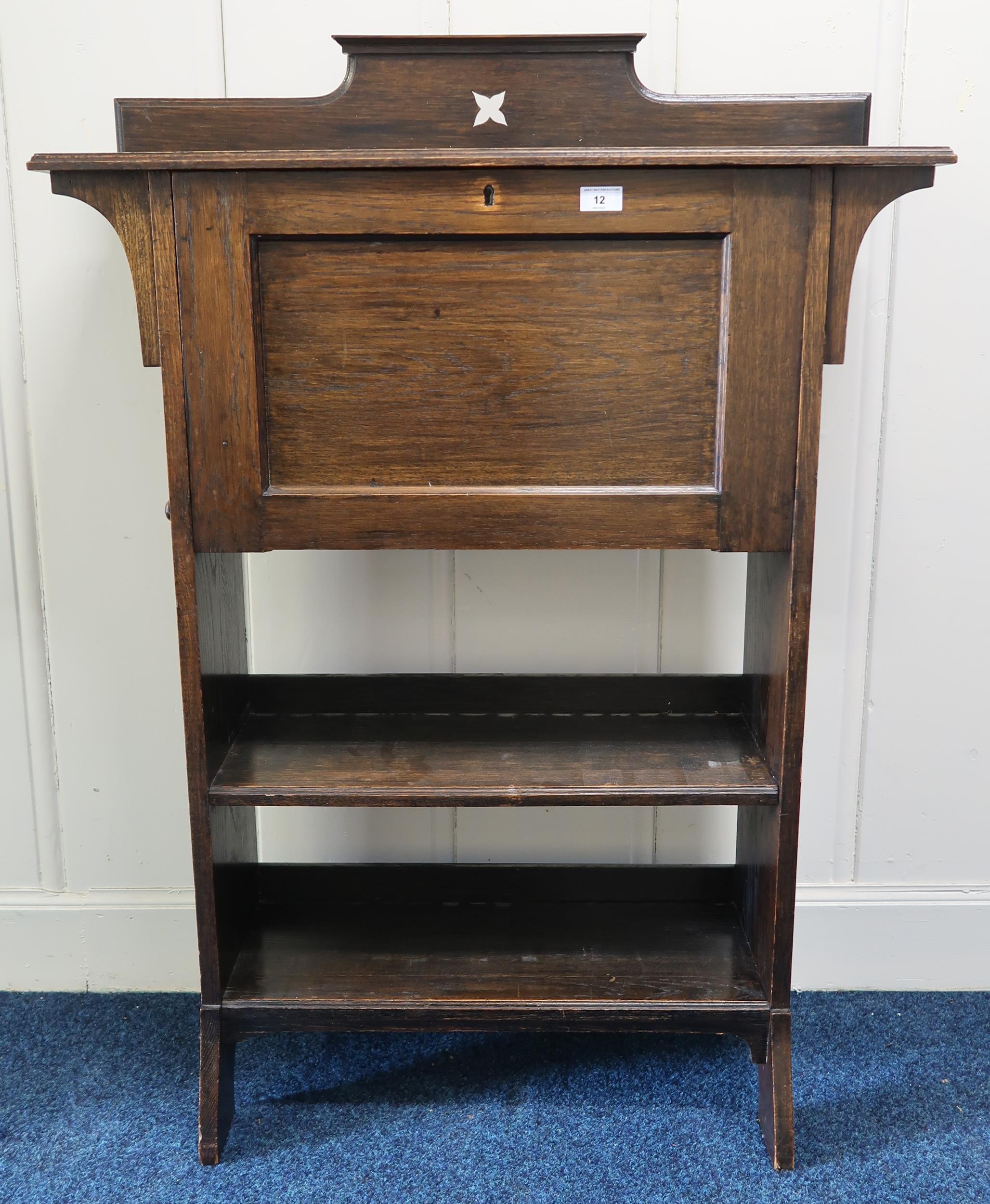 A 20th century oak arts and crafts fall front writing bureau and an oak drop end two door side