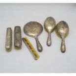 An Edwardian six piece silver dressing set, comprising two clothes brushes, two hand brushes, a hand