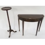 A 20th century mahogany demi lune occasional table and a mahogany plant stand on tripod base (2)