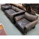 A mid 20th century black laminate framed three piece suite with black leather upholstery and two