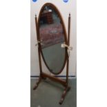 An early 20th century mahogany framed oval cheval mirror, 150cm high Condition Report:Available upon