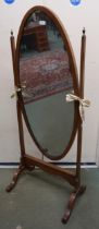 An early 20th century mahogany framed oval cheval mirror, 150cm high Condition Report:Available upon
