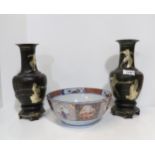 A pair of Chinese lacquer and silvered vases, decorated with fighting scenes, with a Greek key