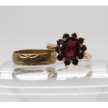 A 9ct gold garnet cluster ring size O, together with a 9ct wedding ring, size L1/2, weight