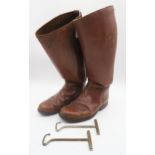 A pair of brown leather riding boots numbered C3452, with boot pulls and a riding hat Condition