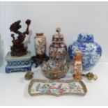 A Canton tray decorated with figures, a cloisonné ginger jar in blue and white enamel, an Imari