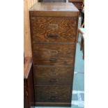 A 20th century oak four drawer filing cabinet, 131cm high x 51cm wide x 64cm deep Condition Report: