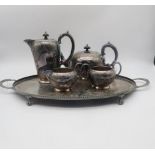 A five piece silver plated tea service, comprising tea pot. coffee pot, sugar bowl, cream jug and