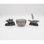 A Chinese export silver glass lined sugar bowl, decorated with dragons chasing flaming pearls, by