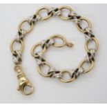 A 9ct yellow and white good fancy link bracelet, length 20cm, weight 19.9gms Condition Report: