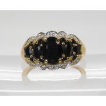A 9ct gold sapphire and diamond accent ring, size P, weight 4.1gms Condition Report:Available upon