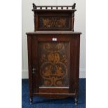 A Victorian oak music cabinet with inlaid pokerwork panels Condition Report:Available upon request