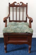 An early 20th century mahogany commode armchair with ceramic pot interior Condition Report:Available
