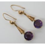 A pair of 14k gold faux amethyst drop earrings, length 5cm, weight 5.4gms Condition Report:Available