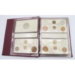 A King George VI specimen coin collection from 1937 to 1952 in album, together with Elizabeth II