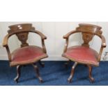 A pair of oak framed revolving ships captain chairs with red rexine seats (2) Condition Report: