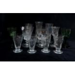 A selection of antique glasses, including liquor glasses with capstan stems, two petal cut green