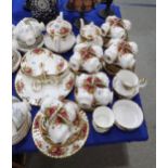 A Royal Albert Old Country Roses teaset comprising large and smaller teapots, cakeplate, cups,