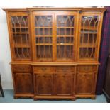 A 20th century mahogany breakfront glazed bookcase, 197cm high x 192cm wide x 41cm deep Condition