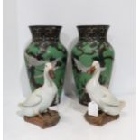 A pair of Chinese glazed models of geese, 20cm, with inscription to stem, possibly Guangxu, a pair