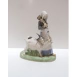 A Royal Copenhagen figure of a girl and goats Condition Report:Available upon request