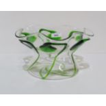 An Art Nouveau glass bowl, the body decorated with stylised green trailed decoration, the rim