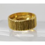 A 22ct gold wedding ring, size L1/2, weight 6.5gms Condition Report:Available upon request