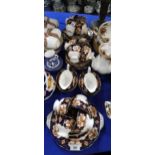 A Royal Albert Heirloom pattern tea service comprising twelve cups, saucers and plates, milk jugs