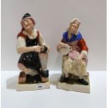 A pair of Victorian pottery figures of a cobbler and wife Condition Report:Available upon request