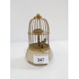 An Austrian wind up singing bird in cage clock Condition Report:Available upon request