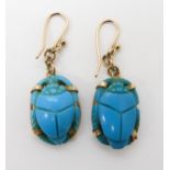 A pair of carved turquoise scarab earrings the mounts with Arabic hallmarks, weight 8.6gms Condition