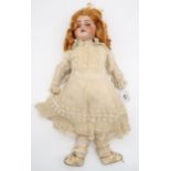 A golden haired child's doll Condition Report:Available upon request