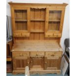 A 20th century pine kitchen dresser, 192cm high x 137cm wide x 48cm deep Condition Report: