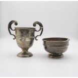A George V silver twin handled trophy cup, by William Neale Ltd, Birmingham 1922, and an Edwardian