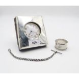 A silver mounted clock, of square form with bevelled edges, leather backing, by Deakin & Francis,