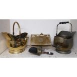 A brass freestanding book rest and two brass helmet form coal buckets (3) Condition Report:Available