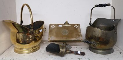 A brass freestanding book rest and two brass helmet form coal buckets (3) Condition Report:Available