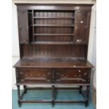 An early 20th century oak Jacobean style kitchen dresser, 208cm high x 153cm wide x 50cm deep