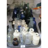 Assorted antique bottles and jars in glass and ceramic Condition Report:Not available for this lot.