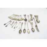 A collection of silver flatware including five Victorian provincial silver tea spoons, in the fiddle