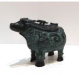 A Chinese bronze vessel modelled as Bull Zun, with wood stand, in presentation box Bought from the