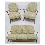 A MID 20TH CENTURY ELM AND BEECH ERCOL THREE PIECE SUITE comprising three seater settee, 78cm high x