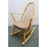A mid 20th century Ercol elm and beech rail back rocking chair Condition Report:Available upon