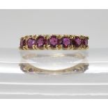 A 9ct gold seven stone ruby ring, size L, weight 2gms Condition Report:Available upon request