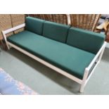 A 20th century white painted day bed with green upholstery Condition Report:Available upon request